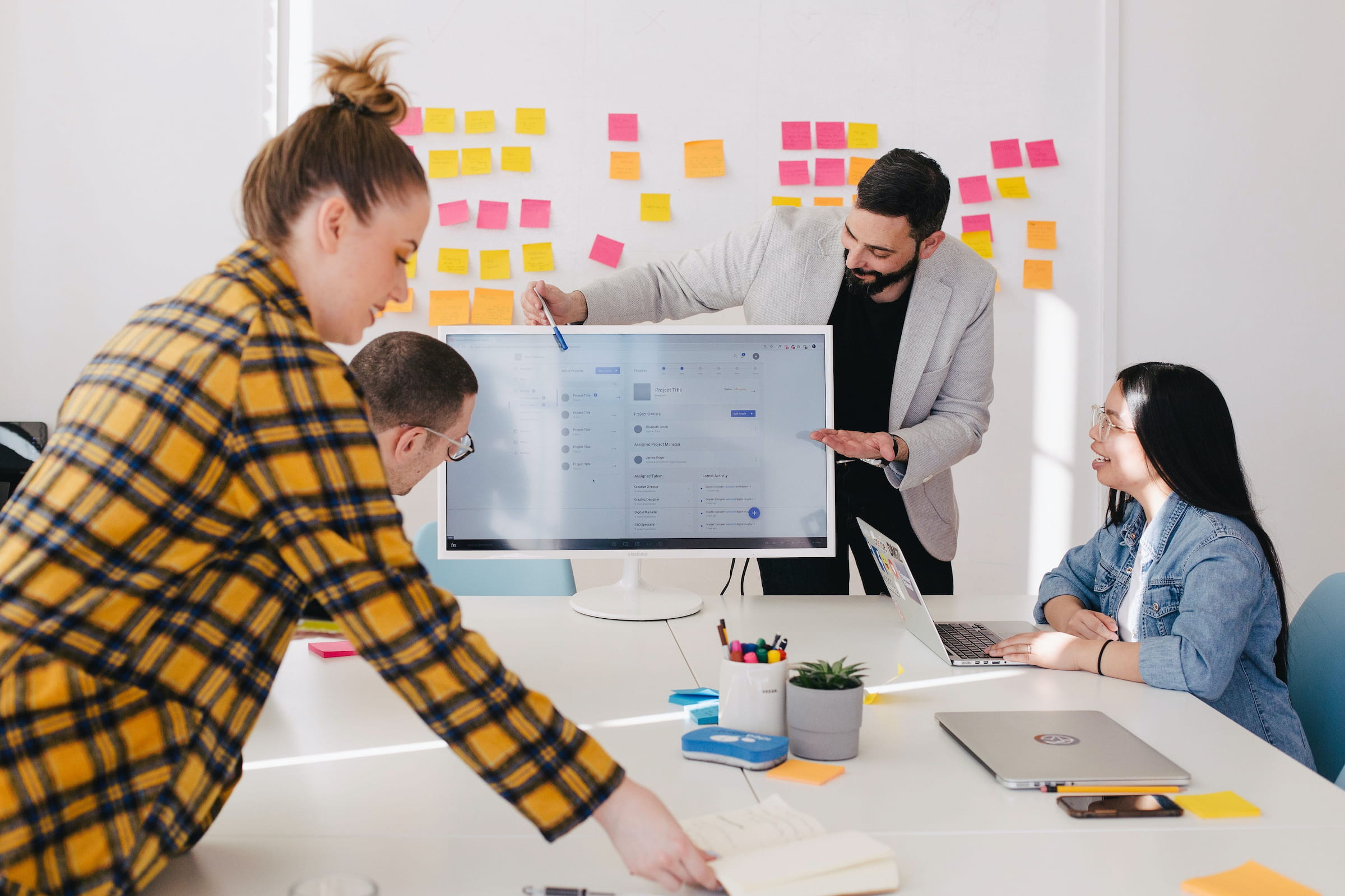 A consulting team reviewing a digital business system